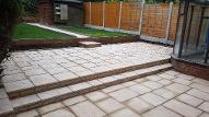 Split level patios and pathway in Kings Norton with sleepers and chip bark.