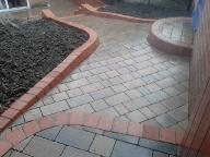 shaped block paving and bull nose steps and path.