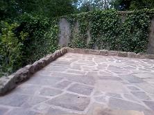 crazy paved patio and sandstone edging in moseley,